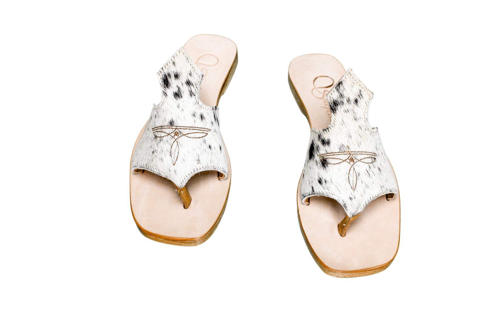 Hair-on hide and leather flip flop sandals perfect for sunny days. Western footwear