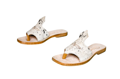 Hair-on hide and leather flip flop sandals perfect for sunny days. Western footwear