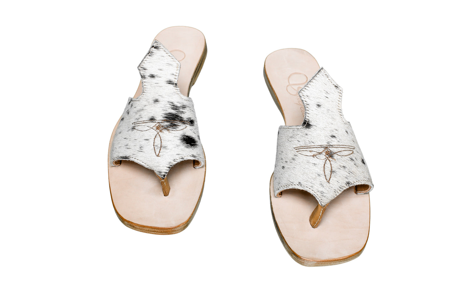 Hair-on hide and leather flip flop sandals perfect for sunny days. Western footwear