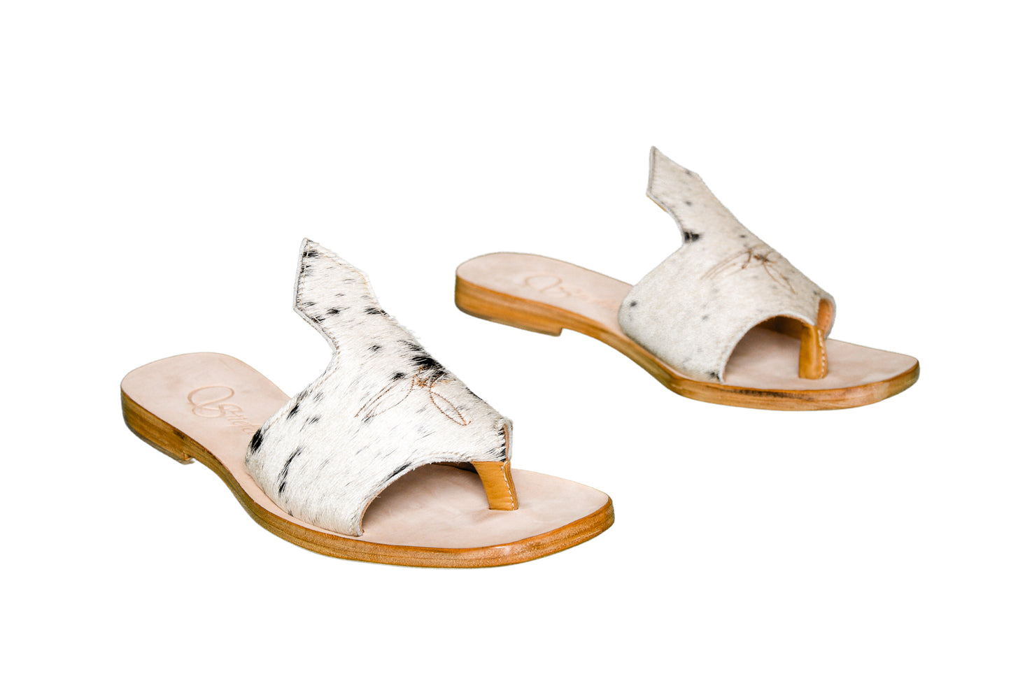 Hair-on hide and leather flip flop sandals perfect for sunny days. Western footwear