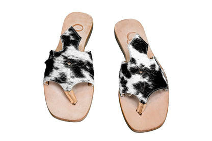 Hair-on hide and leather flip flop sandals perfect for sunny days. Western footwear