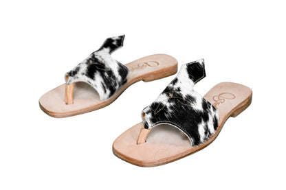 Hair-on hide and leather flip flop sandals perfect for sunny days. Western footwear