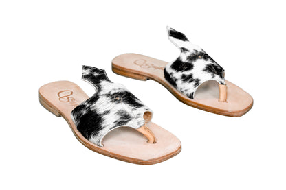 Hair-on hide and leather flip flop sandals perfect for sunny days. Western footwear