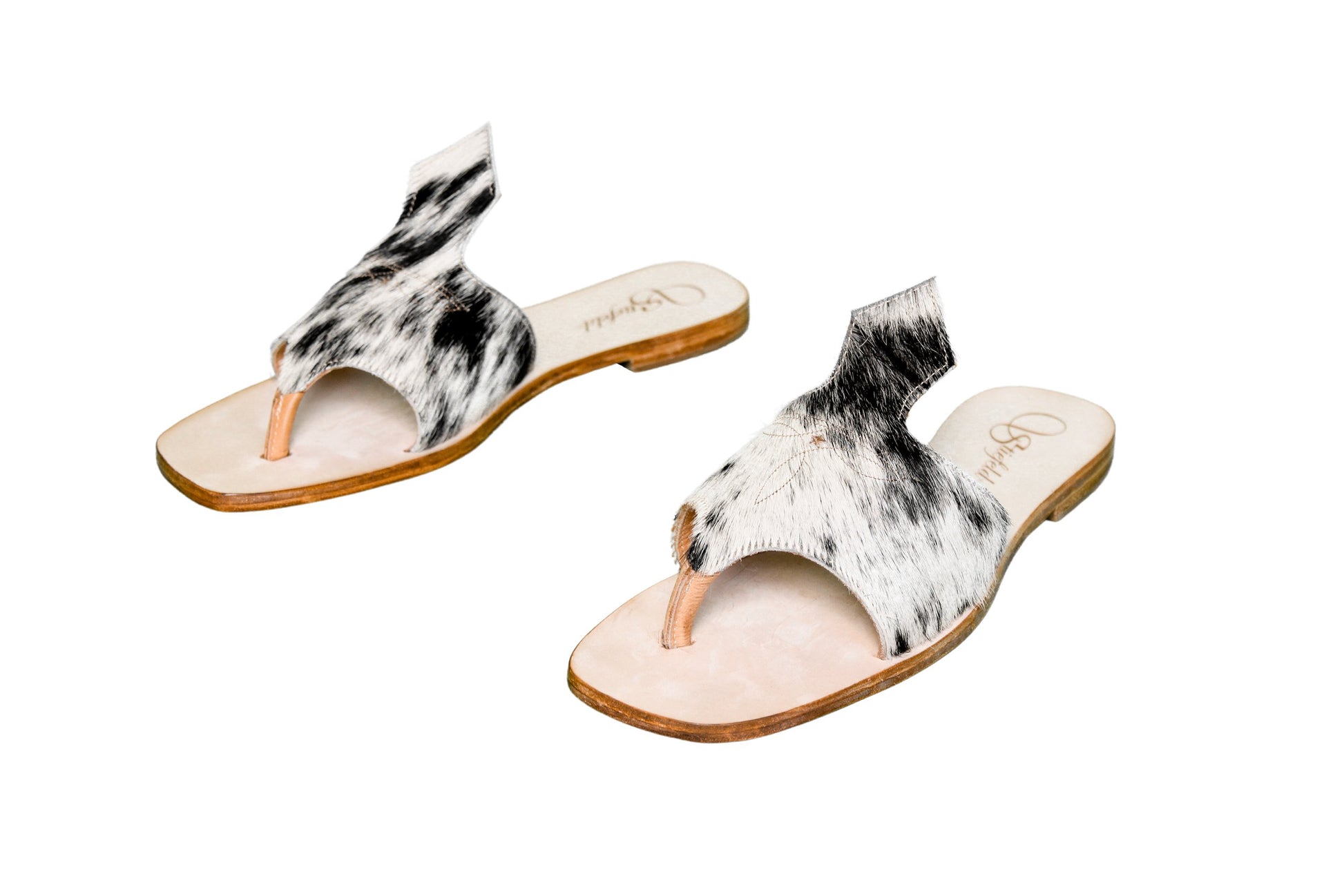 Hair-on hide and leather flip flop sandals perfect for sunny days. Western footwear