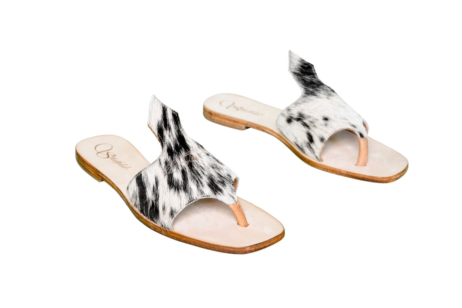 Hair-on hide and leather flip flop sandals perfect for sunny days. Western footwear